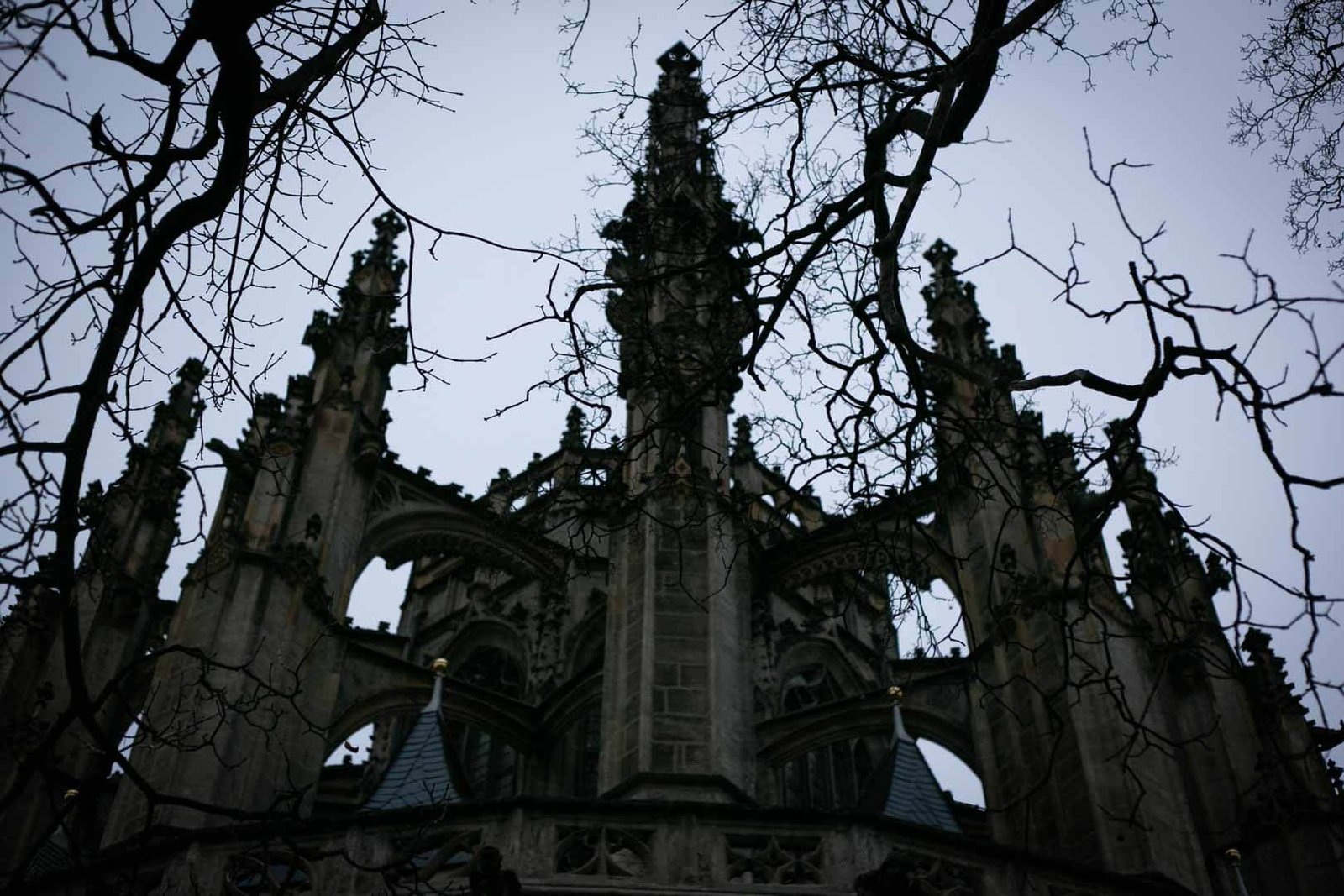Low-angle view of St. Barbara's Church in Kutná Hora, showcasing its Gothic architecture and UNESCO World Heritage significance.